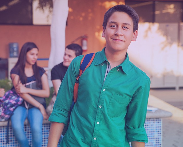 Image of a middle school student walking home after his career development class where he is learning about the importance of career readiness.